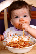 Child Eating in Chair